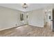 Bedroom featuring hardwood-style floors, base molding, and windows at 2401 Westland Way, Acworth, GA 30102
