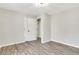 Bedroom with wood-look floors, neutral paint, closet and bright overhead light at 2401 Westland Way, Acworth, GA 30102