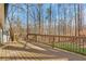 Large wooden deck with railing providing a great outdoor space with views of the surrounding landscape at 2401 Westland Way, Acworth, GA 30102