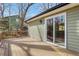 Wooden deck with sliding glass door provides seamless indoor-outdoor living and scenic views of the backyard at 2401 Westland Way, Acworth, GA 30102