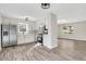 Open kitchen with stainless steel appliances, granite countertops, and modern lighting at 2401 Westland Way, Acworth, GA 30102
