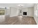Spacious living room with wood-look flooring, fireplace and access to a deck at 2401 Westland Way, Acworth, GA 30102
