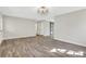 Open-concept living room with updated flooring, neutral paint, and modern lighting at 2401 Westland Way, Acworth, GA 30102
