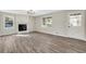 Bright and spacious living room with a stone fireplace and stylish flooring at 2401 Westland Way, Acworth, GA 30102