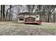 Backyard view of home featuring deck and screened in porch and wooded area at 260 N Fayette Dr, Fayetteville, GA 30214