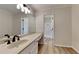 Bathroom with a vanity and black faucet, plus an adjacent toilet and shower at 260 N Fayette Dr, Fayetteville, GA 30214