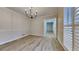 Sunlit dining room with modern light fixture and beautiful flooring at 260 N Fayette Dr, Fayetteville, GA 30214