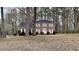 Charming two-story brick home with a well-maintained lawn and mature trees at 260 N Fayette Dr, Fayetteville, GA 30214