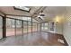 Sunroom featuring wood floors, skylights and door leading to a wooden deck at 260 N Fayette Dr, Fayetteville, GA 30214