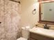 Well-maintained bathroom with a vanity, sink, mirror, toilet and a shower with curtain at 3533 Saddlebrook Dr, Loganville, GA 30052