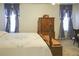 A spacious bedroom with window curtains at 3533 Saddlebrook Dr, Loganville, GA 30052