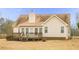Rear exterior view of a house with a deck, siding, roof, and chimney at 3533 Saddlebrook Dr, Loganville, GA 30052