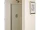 Bathroom shower with glass door and brushed nickel shower head at 3533 Saddlebrook Dr, Loganville, GA 30052