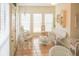 Bright sunroom filled with light, wicker furniture and tile flooring at 3533 Saddlebrook Dr, Loganville, GA 30052