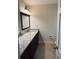 Bright bathroom with granite counters and updated fixtures at 4617 N Peachtree Rd, Dunwoody, GA 30338