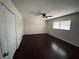 Well-lit bedroom with ceiling fan, neutral walls, and hardwood floors. Lots of closet space at 4617 N Peachtree Rd, Dunwoody, GA 30338