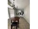 Cozy breakfast nook with tiled floors, white molding, a chandelier, and natural light streaming through the windows at 4617 N Peachtree Rd, Dunwoody, GA 30338