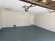 Spacious garage with painted walls and epoxy flooring at 4617 N Peachtree Rd, Dunwoody, GA 30338
