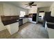 Bright kitchen with updated stainless steel appliances and tiled floors at 4617 N Peachtree Rd, Dunwoody, GA 30338