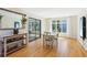 Bright dining room featuring a light wood floor, sliding glass doors, and recessed lighting at 10015 Timberstone Rd, Alpharetta, GA 30022