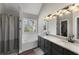 Bathroom featuring double sinks, granite countertops, and shower-tub combination at 1007 Crown River Pkwy, Mcdonough, GA 30252