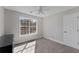 Bedroom with neutral carpet, a large window, and a ceiling fan at 1007 Crown River Pkwy, Mcdonough, GA 30252