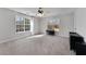 Bright bedroom with large windows, natural light, and neutral carpet at 1007 Crown River Pkwy, Mcdonough, GA 30252