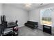 Bedroom with a desk, futon, and large window perfect for studying at 1007 Crown River Pkwy, Mcdonough, GA 30252