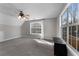 Spacious bonus room with windows, natural light, and neutral carpet at 1007 Crown River Pkwy, Mcdonough, GA 30252