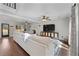 Expansive living area with hardwood floors, modern furniture, and large windows for natural light at 1007 Crown River Pkwy, Mcdonough, GA 30252