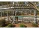 Relaxing pool area with covered pergola and seating, perfect for enjoying outdoor leisure time at 1007 Crown River Pkwy, Mcdonough, GA 30252