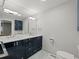 Modern bathroom with double vanity, marble countertop, and sleek fixtures at 2153 Starfire Drive Ne Dr, Atlanta, GA 30345