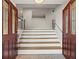 A welcoming entryway with a staircase featuring a unique patterned floor and glass paneled front door at 2153 Starfire Drive Ne Dr, Atlanta, GA 30345