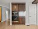Modern kitchen with stainless steel appliances and custom wood cabinetry and flooring at 2153 Starfire Drive Ne Dr, Atlanta, GA 30345