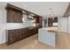 Open-concept kitchen features wood cabinetry, white countertops, and an island with sink at 2153 Starfire Drive Ne Dr, Atlanta, GA 30345