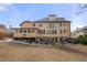 Large grassy backyard with patio, outdoor furniture, and detached garage at 3017 Canton Pines, Marietta, GA 30068