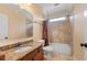 Neutral bathroom with granite countertop vanity, tub and tiled shower at 3017 Canton Pines, Marietta, GA 30068