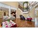 Elegant staircase with iron railing and view into kitchen and high ceilings at 3017 Canton Pines, Marietta, GA 30068