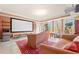 Entertainment space including a large projector screen, comfortable seating, and tile flooring at 3017 Canton Pines, Marietta, GA 30068