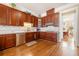 Well-equipped kitchen with dark wood cabinetry, stainless steel appliances, and hardwood floors at 3017 Canton Pines, Marietta, GA 30068