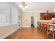 Bright kitchen with hardwood floors, large windows, and a breakfast bar with counter seating at 3017 Canton Pines, Marietta, GA 30068
