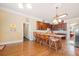 Open kitchen featuring an island with seating, custom cabinets, and hardwood floors at 3017 Canton Pines, Marietta, GA 30068