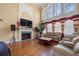 Grand living room featuring a fireplace, soaring ceilings, and large windows with natural light at 3017 Canton Pines, Marietta, GA 30068