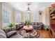 Cozy sitting area with decorative sofa and floral accents with hardwood floors at 3017 Canton Pines, Marietta, GA 30068