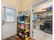 Mud room combined with a pantry featuring built-in shelving, storage, and an exterior door at 3017 Canton Pines, Marietta, GA 30068