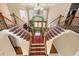 Grand staircase with decorative railings and lush greenery enhancing the home's charm at 3017 Canton Pines, Marietta, GA 30068