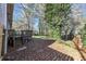 View of the property's lawn, deck, and foliage filled perimeter at 4275 Ridgetop Dr, Ellenwood, GA 30294