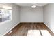 Bedroom with wood floors and large window at 4275 Ridgetop Dr, Ellenwood, GA 30294