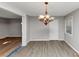 Cozy dining room with chandelier, freshly painted walls, and hardwood flooring, perfect for gatherings at 4275 Ridgetop Dr, Ellenwood, GA 30294
