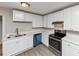 Modern kitchen featuring white cabinets, stainless steel appliances, and sleek countertops at 4275 Ridgetop Dr, Ellenwood, GA 30294